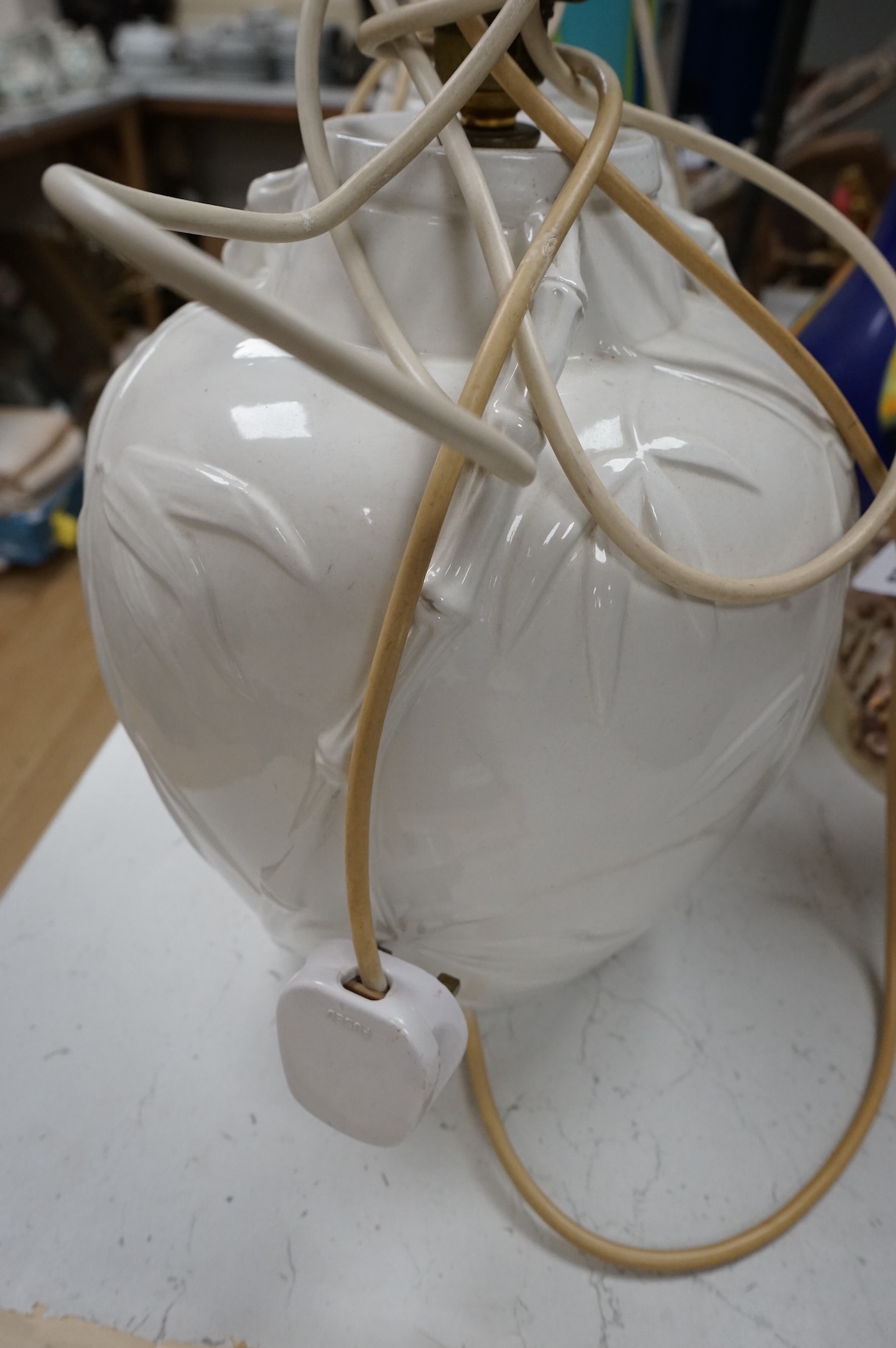 A pair of Chinese porcelain table lamps decorated with bamboo